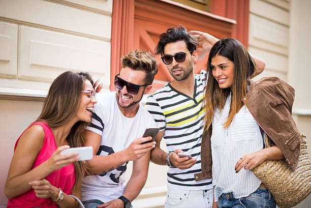 istock Group of friends with mobile phones 494827826