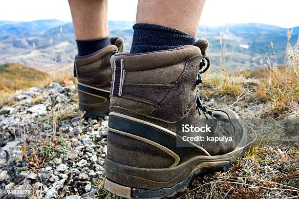 Hiker Jumps Over Stones In Carpathian Mountains With Foot Closeu Stock Photo - Download Image Now