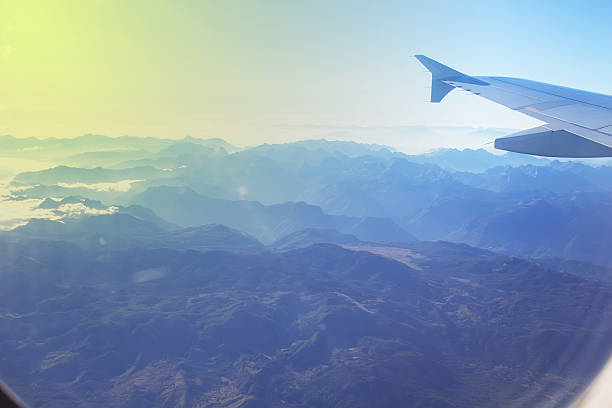 istock View of mountains from a plane window 494828828