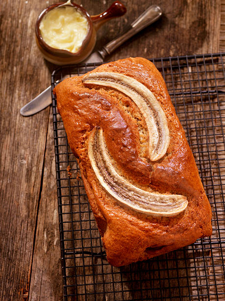 Delicious homemade banana bread or cake on rustic wooden plate