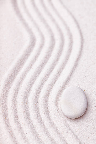 istock Zen garden with a wave lines in the sand 494829770