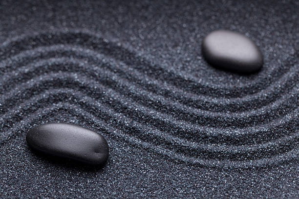 istock Zen garden with a wave lines in the sand 494830078