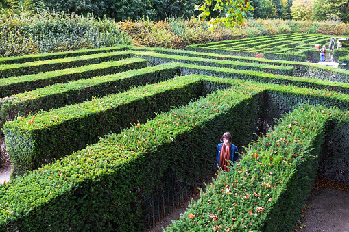 Vienna, Austria - September 29, 2015: tourists in green maze of Schloss Schonbrunn palace garden. The Maze at Schonbrunn was laid out between 1698 and 1740 and consisted of four different parts