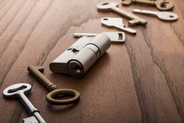 istock door lock with keys on wooden surface 494831800
