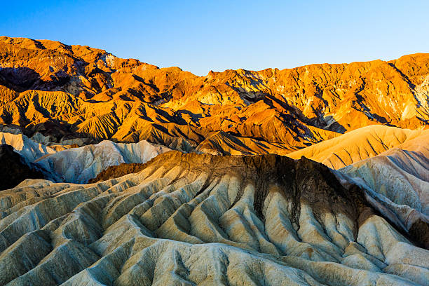sunrise at Zabriskie Point, Death Valley National Park, USA Zabriskie Point is a part of Amargosa Range located in east of Death Valley in Death Valley National Park in the United States noted for its erosional landscape. death valley desert photos stock pictures, royalty-free photos & images
