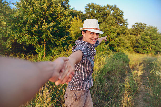 Man with girlfriend are resting together in time walking on nature.
