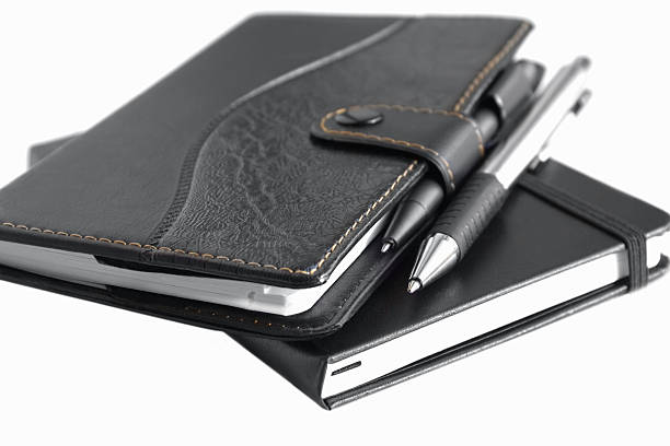 notebooks mit stift - three objects personal organizer book pen stock-fotos und bilder