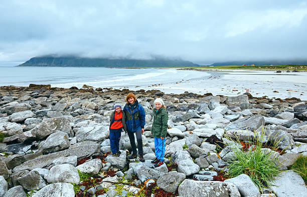 istock Family on summer Ramberg beach (Lofoten, Norway) 494834078