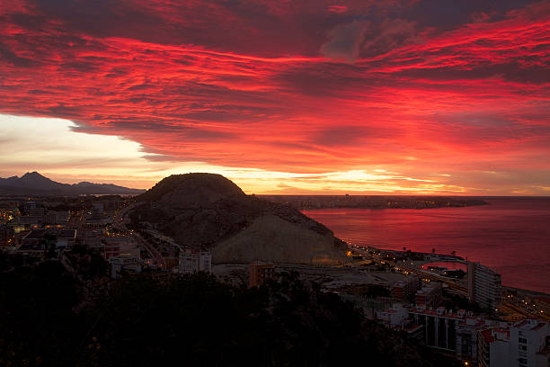 Spectacular sunrise over the Cap de l'Horta in Alicante.