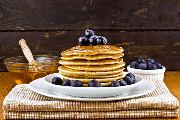 istock Stack of pancakes with fresh blueberry and honey 494836987