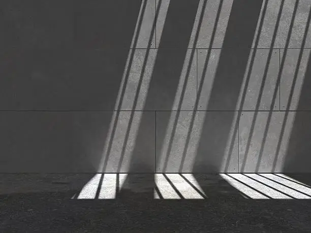 Computer generated contemporary wall lit by streams of sunlight through bars and a slight wet sheen on floor.
