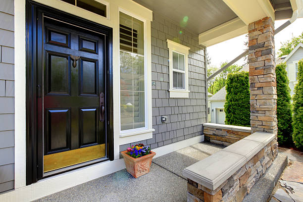 istock Grey house exterior with black door. 494838061