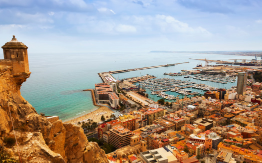 Top view of Port  in Alicante with docked yachts from castle. Spain