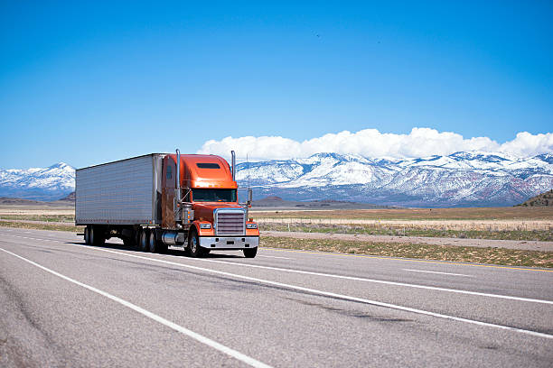 istock Big classic well maintained semi truck on high way 494840775