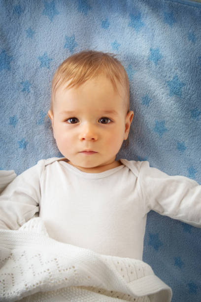 istock One year old baby in the bed 494851146