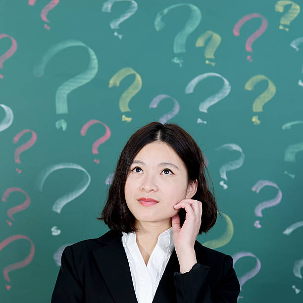 istock Businesswoman with question marks 494852368
