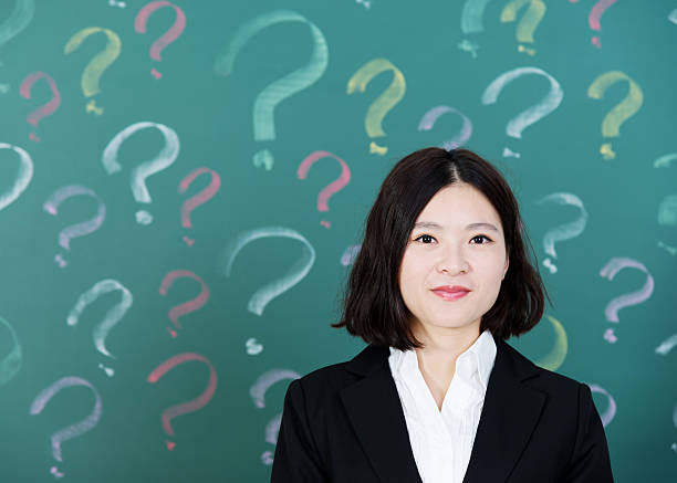 istock Businesswoman with question marks 494852818