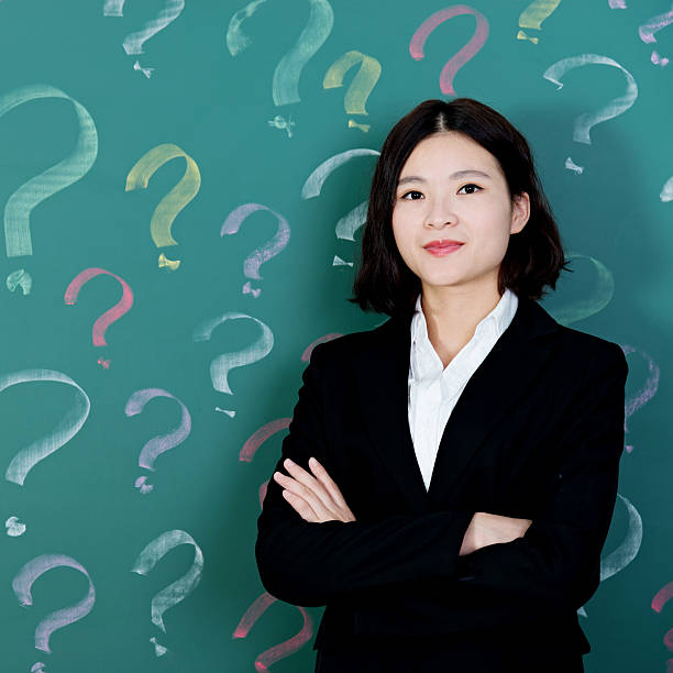 istock Businesswoman with question marks 494852904
