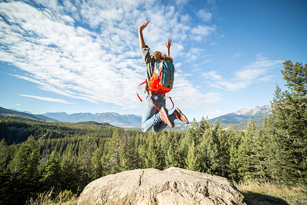 Hiker celebrating at mountain top