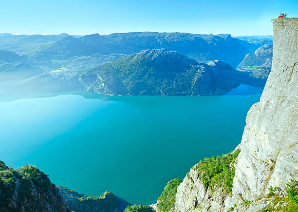 istock Happy family on  Preikestolen massive cliff top (Norway) 494855880