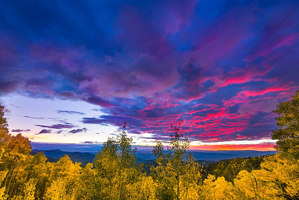Sunset at the Santa Fe Ski Basin New Mexico fall mountain sunset  featuring golden aspens and colorful clouds santa fe new mexico mountains stock pictures, royalty-free photos & images
