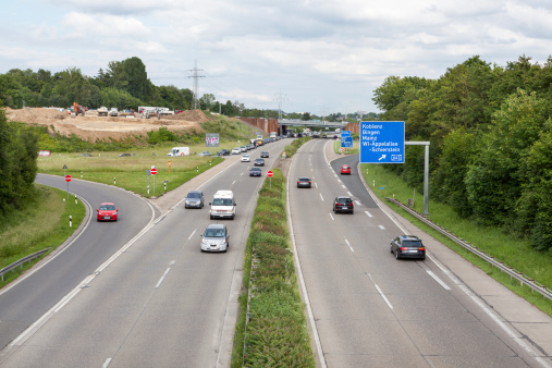 Wiesbaden, Germany - May 28, 2014: Traffic on german Autobahn A66 nearby Schiersteiner Kreuz, view from a bridge. The Bundesautobahn 66 (abbreviated as BAB 66 or A 66) is an autobahn in Germany that connects Fulda and Wiesbaden in the southwest of Germany. Some motion blur