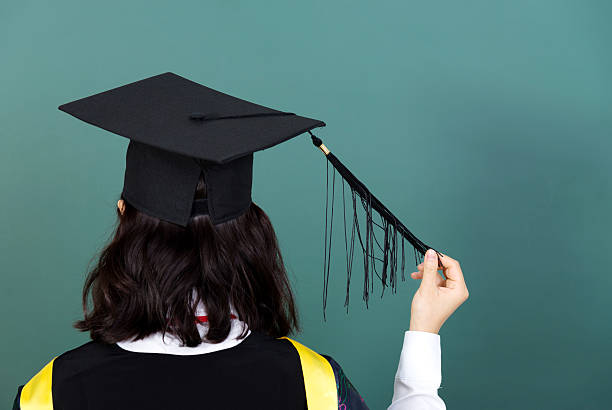 Close-Up Of Mortarboard On Table