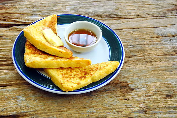 istock French toast and honey for breakfast. 494877160