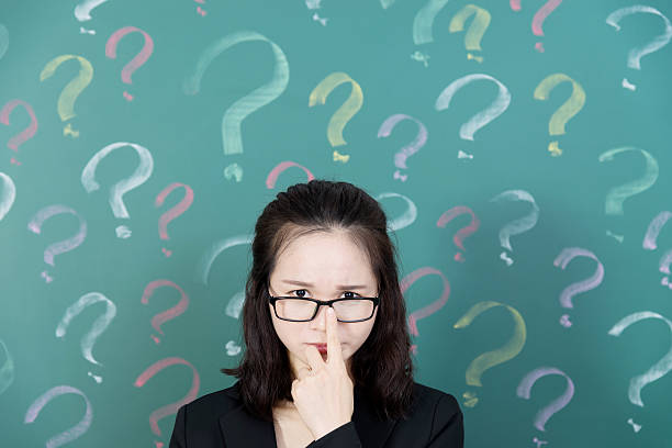 istock Businesswoman with question marks 494878488