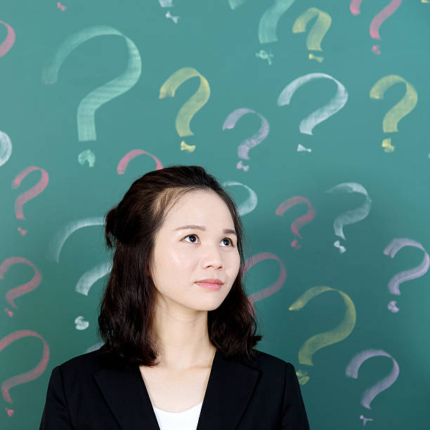 istock Businesswoman with question marks 494878898
