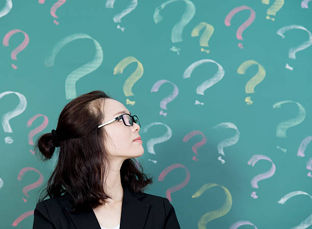 istock Businesswoman with question marks 494878976