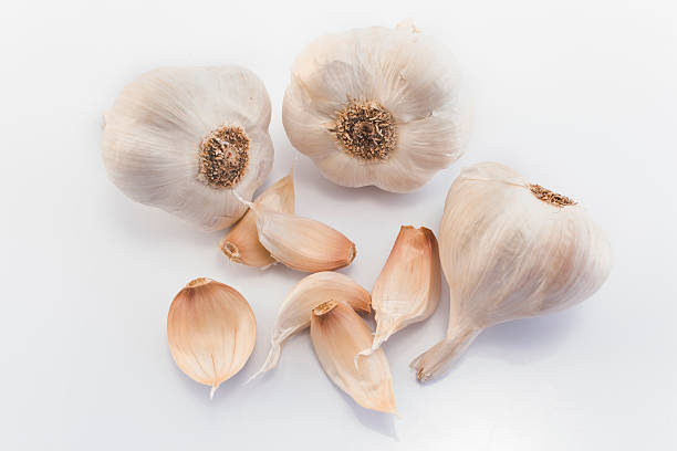 istock Garlic bulbs and cloves, isolated on white 494879530