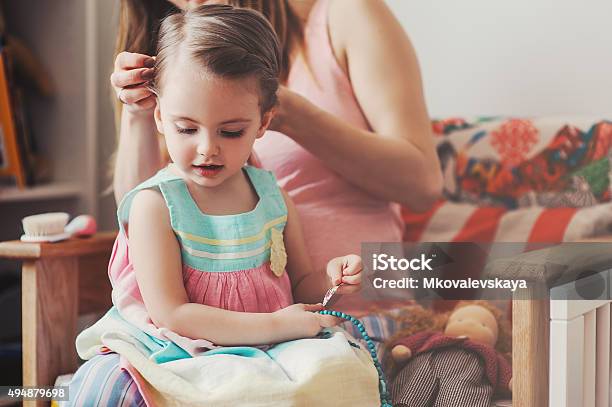 Mother Brushing Toddler Daughter Hair At Home Stock Photo - Download Image Now - Hairbrush, Mother, Toddler