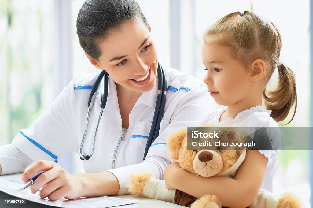 pediatrician doctor examining a child in a hospital 2015 Stock Photo