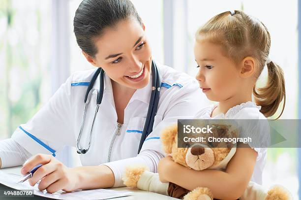 Pediatrician Stock Photo - Download Image Now - 2015, Adult, Care