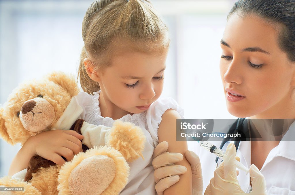 pediatrician doctor examining a child in a hospital Child Stock Photo