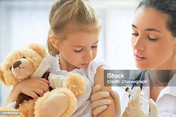 Pediatrician Stock Photo - Download Image Now - Child, Vaccination, Doctor