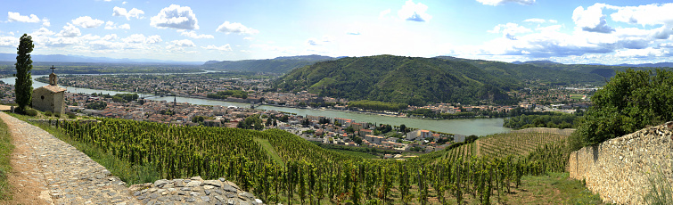 Stiched Panorama made of 6 pictures. The towns of Tournon-sur-Rhône and Tain l'Hermitage crossed by the rhône river. In the background the famous vineyard of Croze-Hermitage
