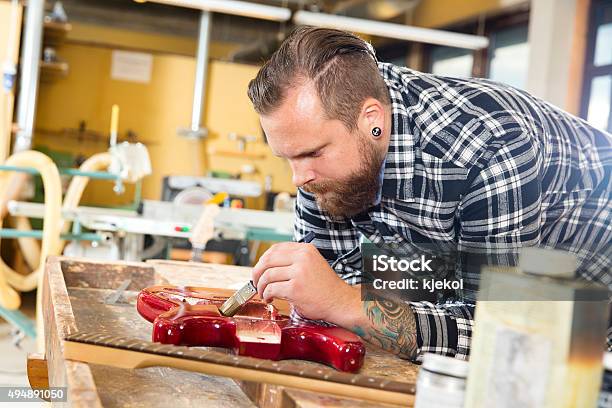 Craftsman Working At Workshop With A Guitar Stock Photo - Download Image Now - Bass Instrument, Craftsperson, 2015