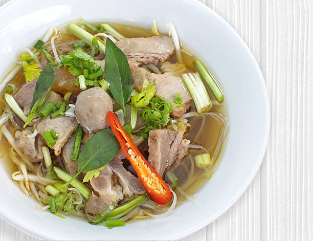 istock Beef Stew Noodle Soup and fresh vegetable on wood table 494891456