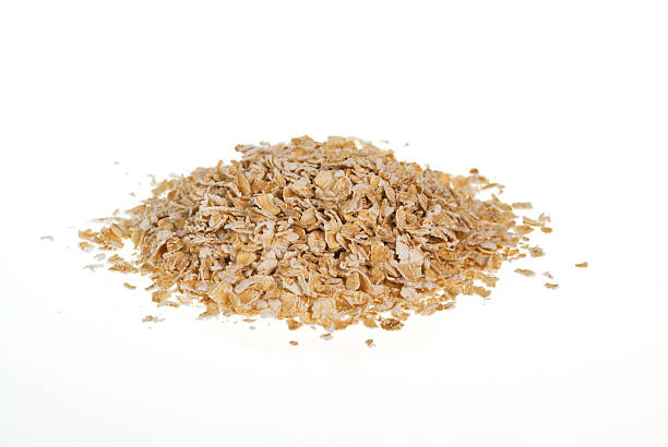 istock Oat flakes pile on white background 494892043