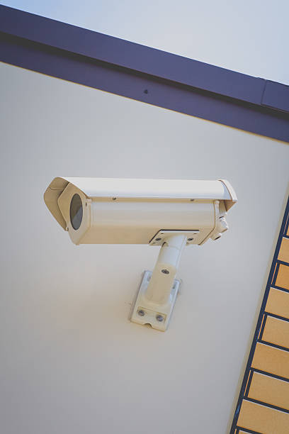 istock Video camera security system on the wall of the building 494892178
