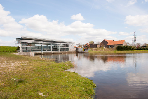Wapenveld, the Netherlands, April 22, 2010: Panoramic view of the modern pumping station 'Veluwe' and the historic pumping station 'Pouwel Bakhuis'.