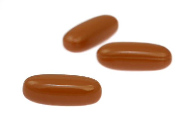 istock brown fish oil capsules isolated on white background 494892379