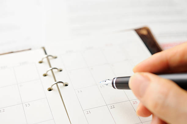 istock Close-up of writing a personal organizer with document. 494893461