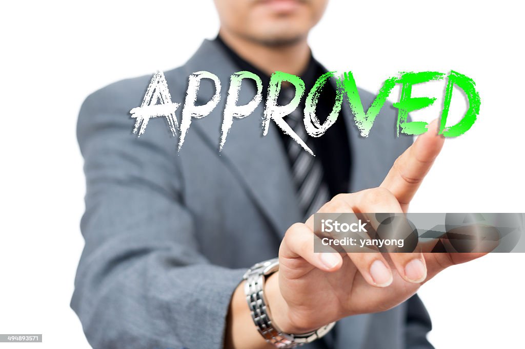 Asian handsome businessman write 'Approved" Accessibility Stock Photo