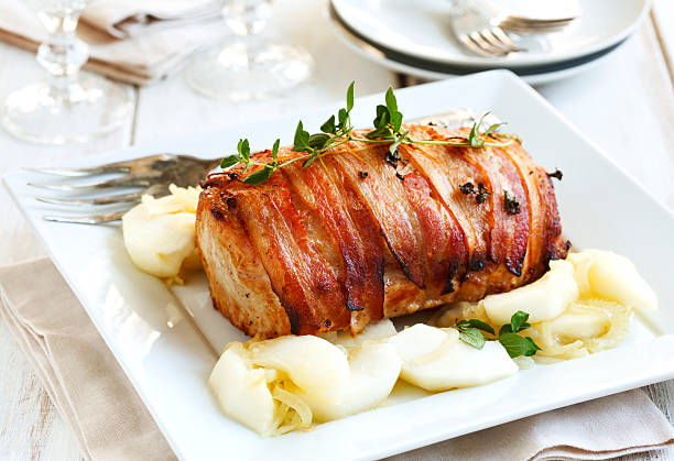 istock Bacon-Wrapped Pork Loin with Apples and Onion 494894996