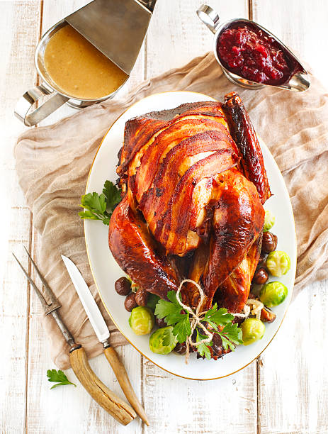 istock Roasted turkey with bacon, chestnuts and brussels sprouts. 494895536