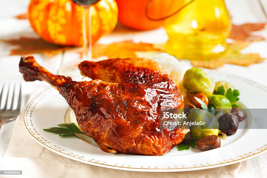 Roasted turkey leg with mash potato, chestnuts and brussels sprouts. Roasted turkey leg garnished with mash potato, chestnuts and brussels sprouts. Chestnut - Food Stock Photo
