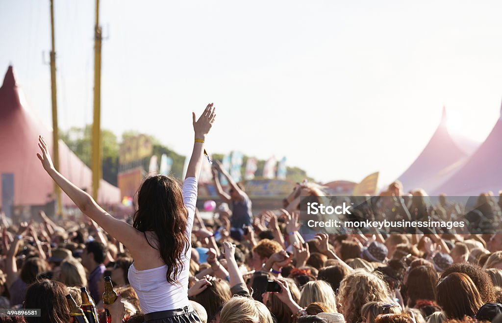 People with their arms in air at music festival Crowds Enjoying Themselves At Outdoor Music Festival With Arms in The Air Music Festival Stock Photo